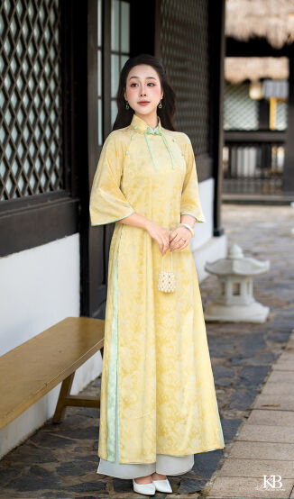 Áo dài nơ cổ đính cúc trang trí